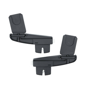 Two black plastic clips on a white background