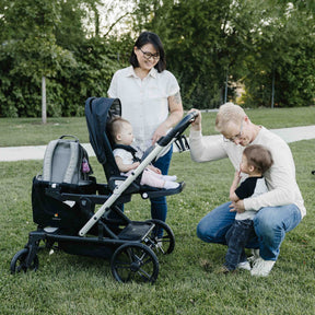 all terrain wheels on a baby stroller with large storage space